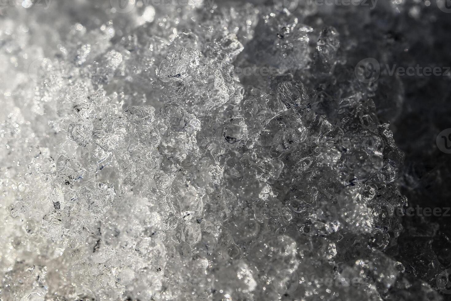 Close up of ice crystals in thawing snow photo