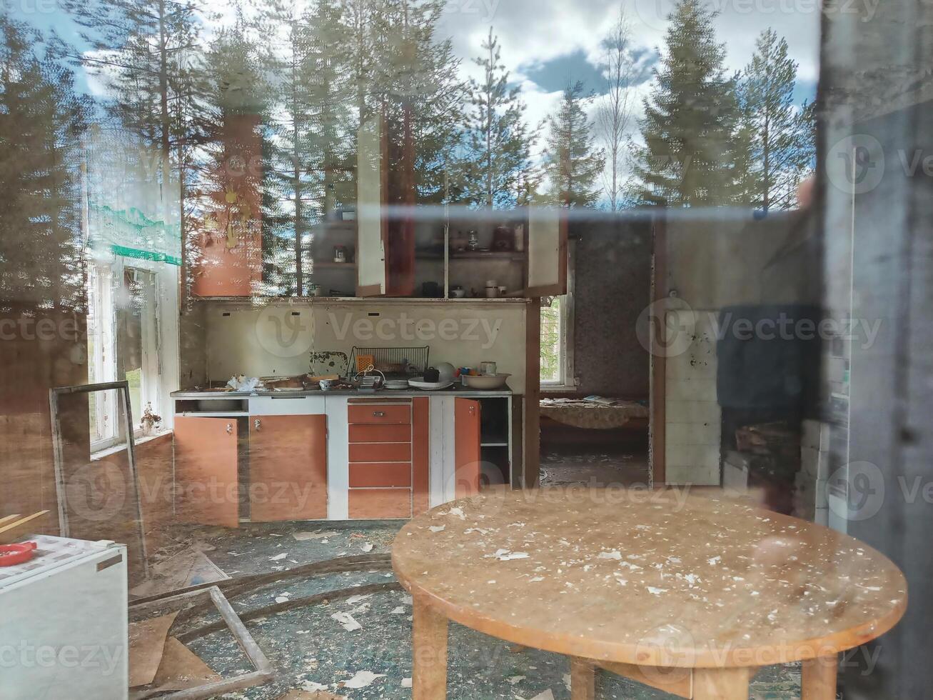 Look into the devasted kitchen of long abandoned house in northern Sweden photo