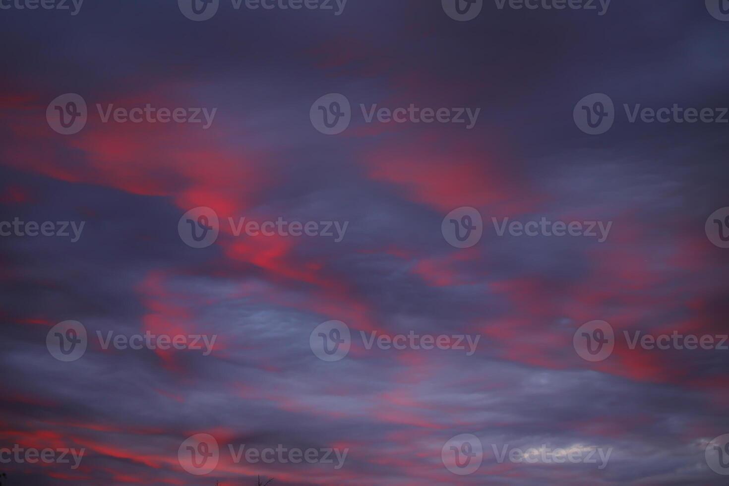 Impressive cloudscape, illuminated by the sun below photo