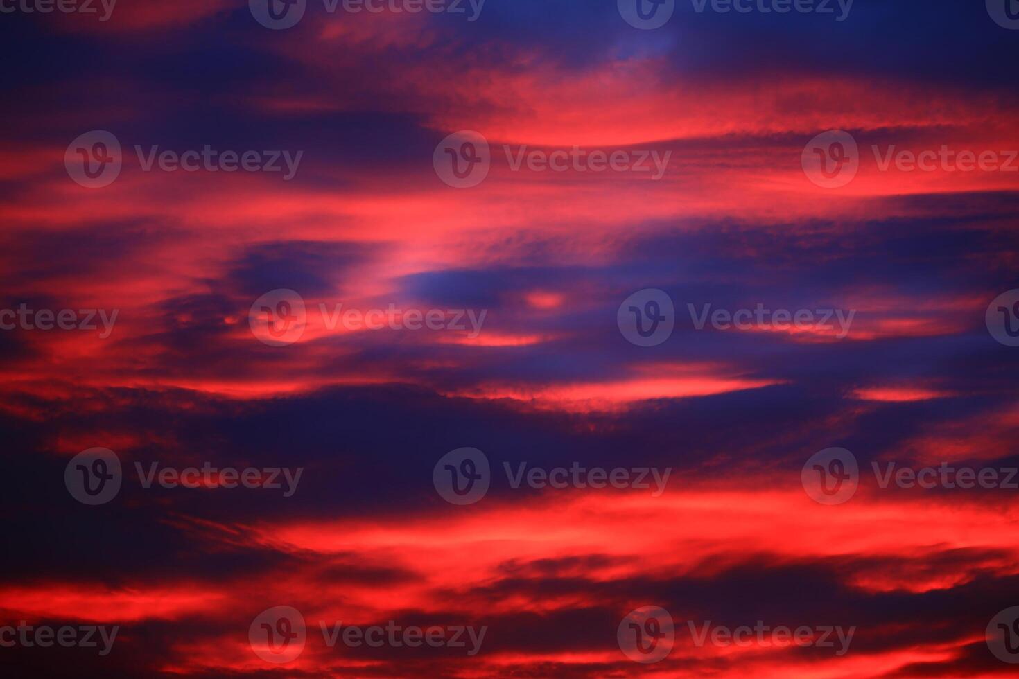 Impressive cloudscape, illuminated by the sun below photo