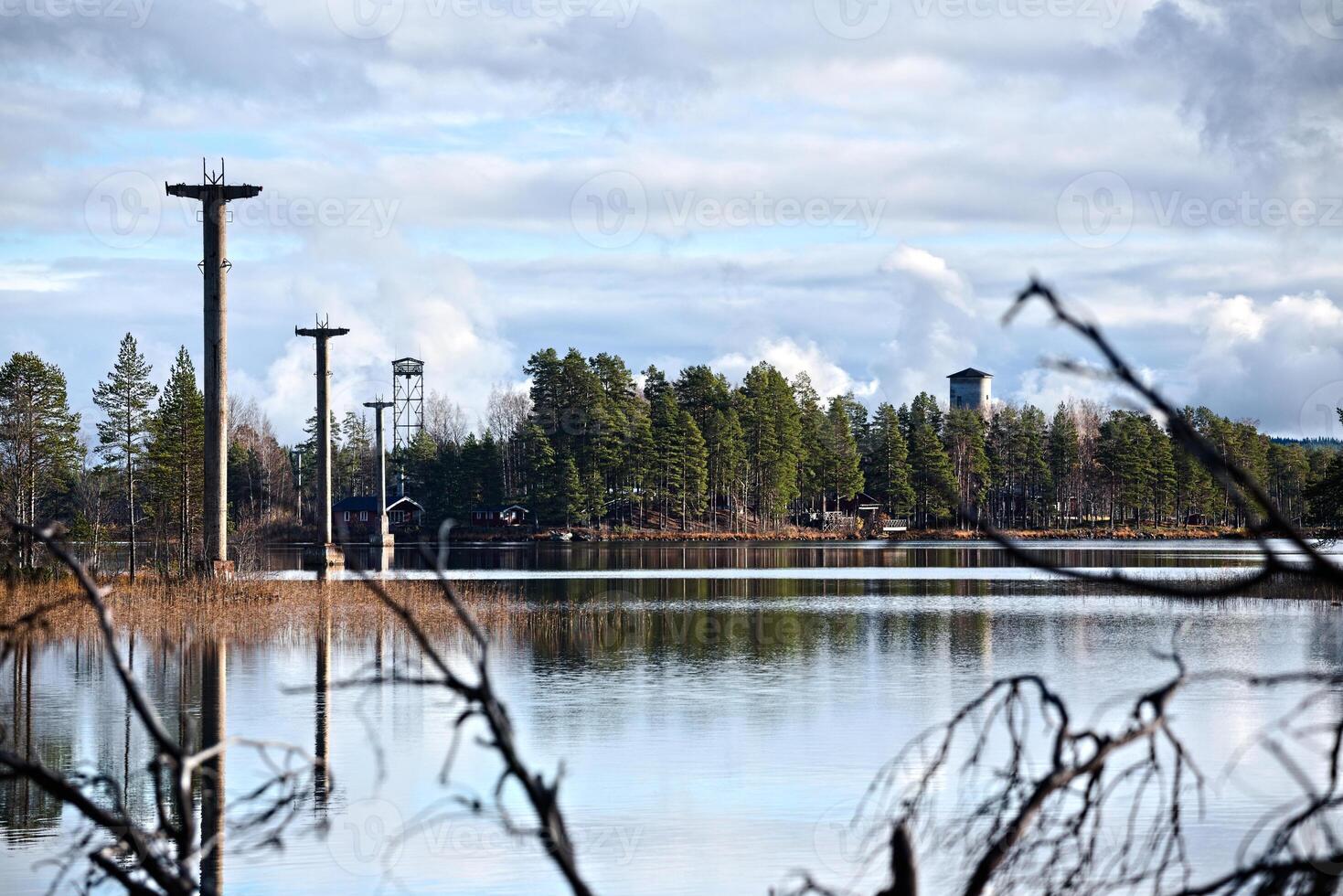 Row of concrete pillars on lake Menstrask, part of the old material ropeway Linbanan Kristineberg-Boliden photo