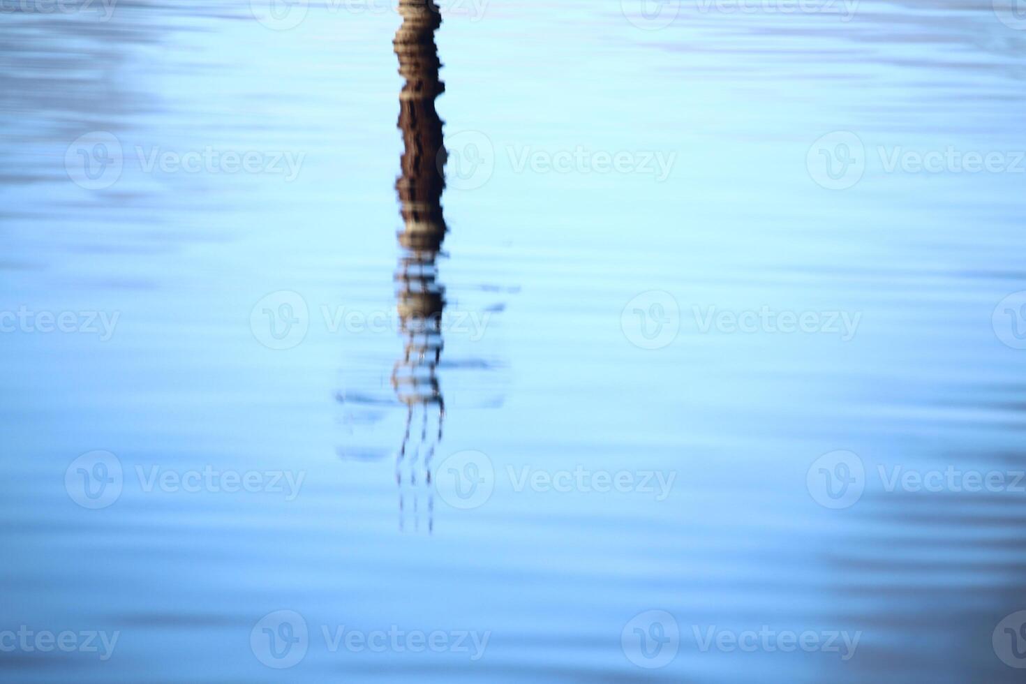 Reflection of concrete pillar on lake Menstrask photo