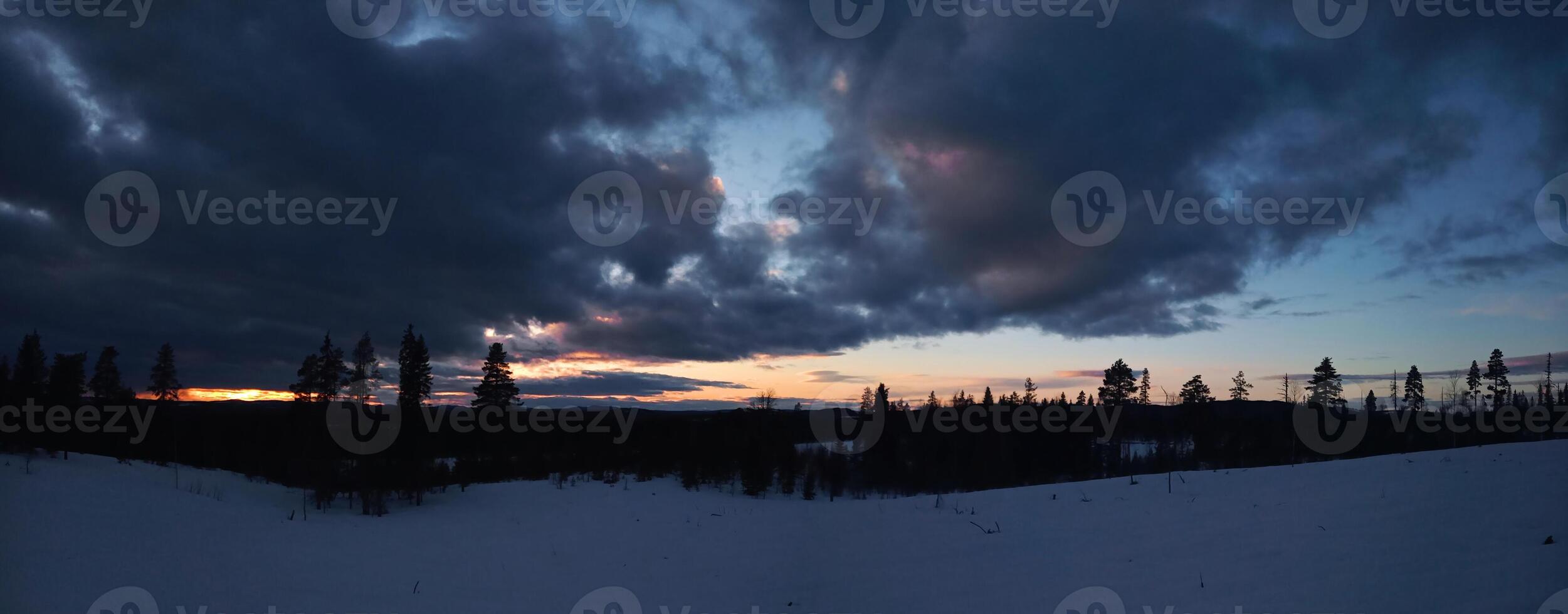 Panorama of dusk and clouds over Swedish Lapland photo