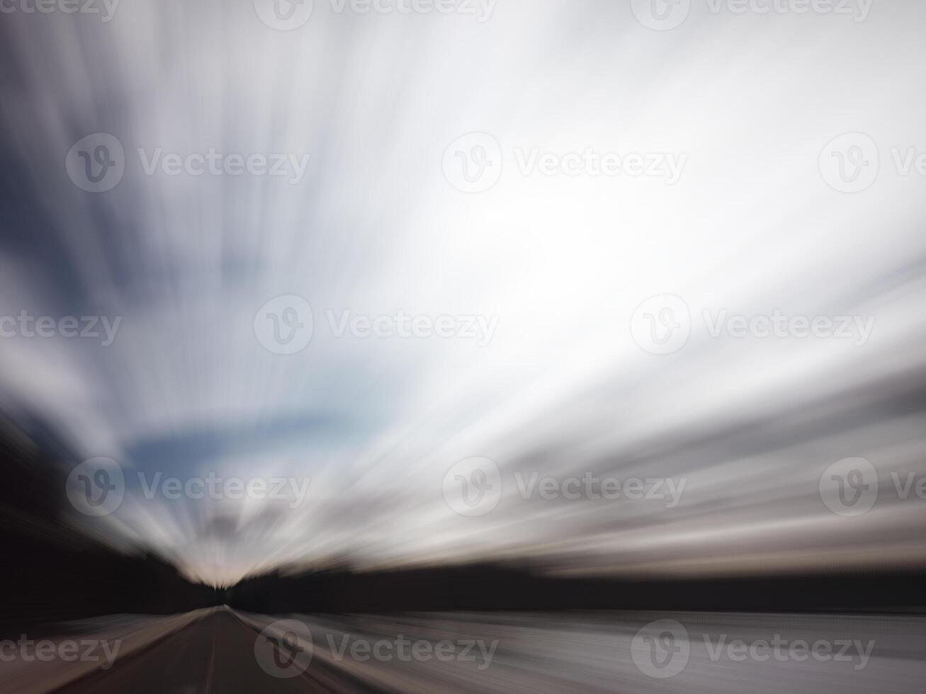 Blurred shot of backlit forest, symbolizing speed photo
