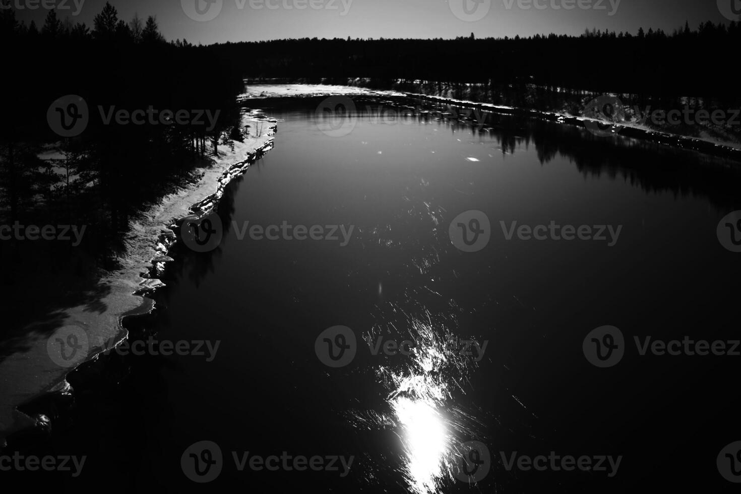 Reflection of moon on Skellefte River in Swedish lapland photo