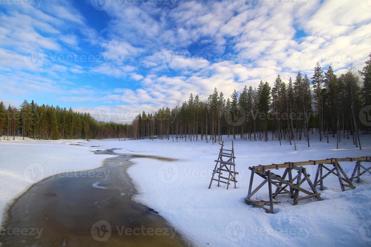 Small frozen river at Rortrask in Swedish Lapland photo