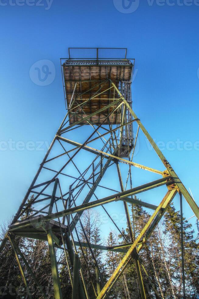 Upward view on old lookout tower in Sweden photo