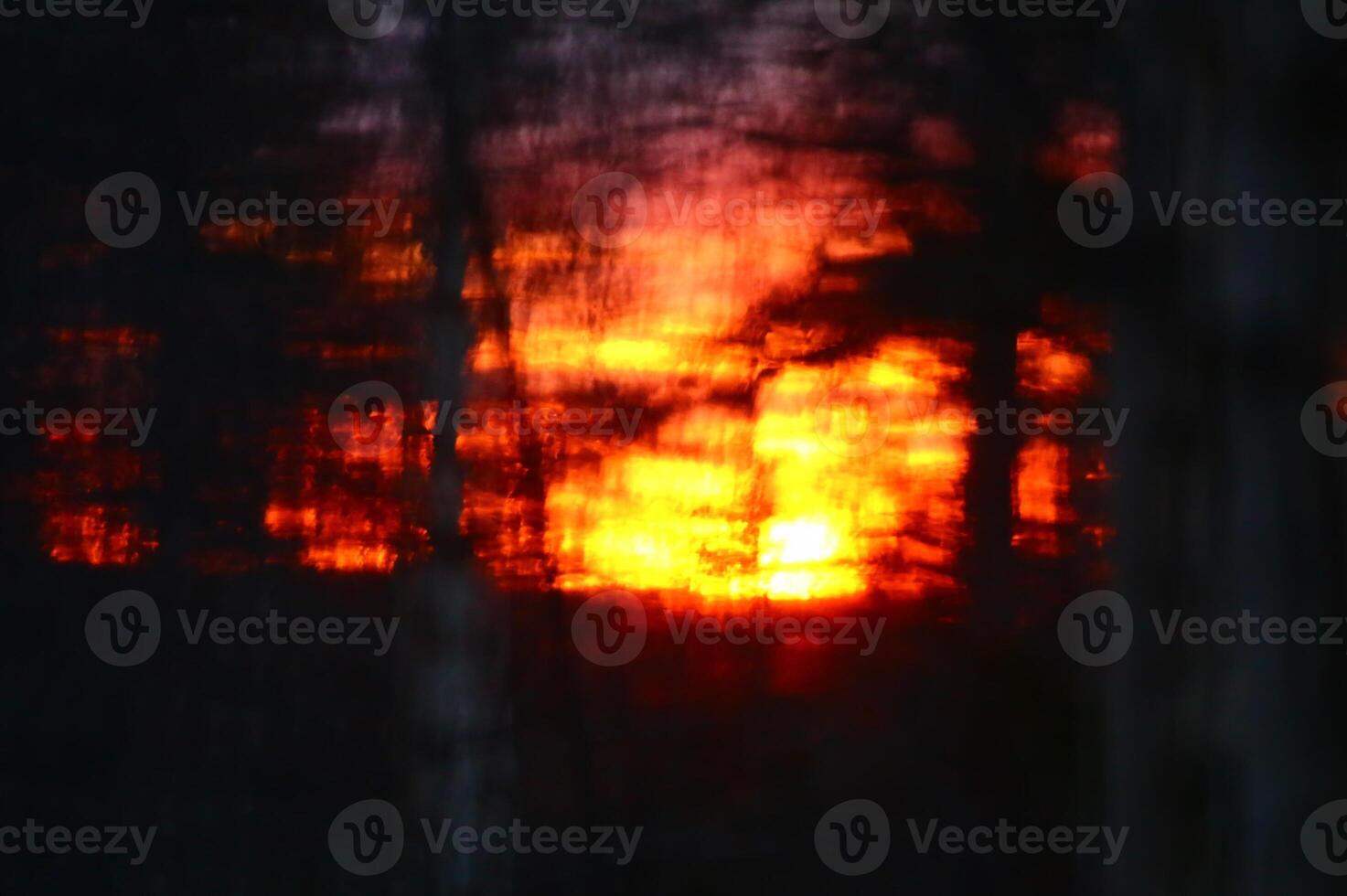 Conceptual blurry shot of glowing orange sunset photo