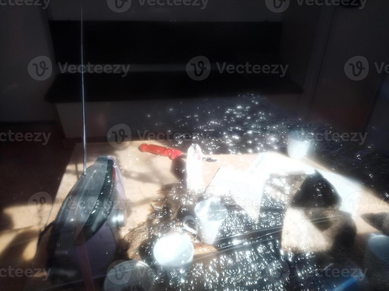 Conceptual shot of light effects in window pane and an abandoned desk photo