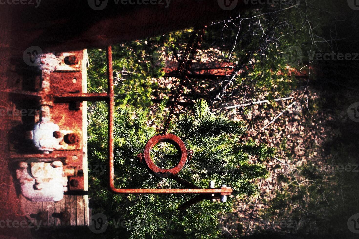 Grungy shot of rusty machinery at an abandoned mine photo