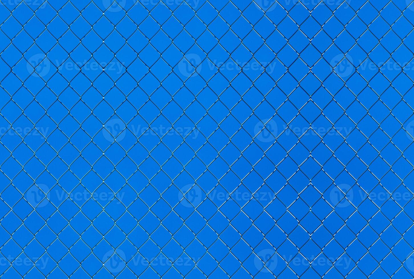 Seamlessly tileable texture of wire mesh on a blue sky photo