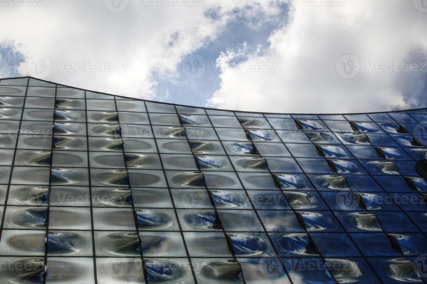 Curved glass facade of a modern building photo