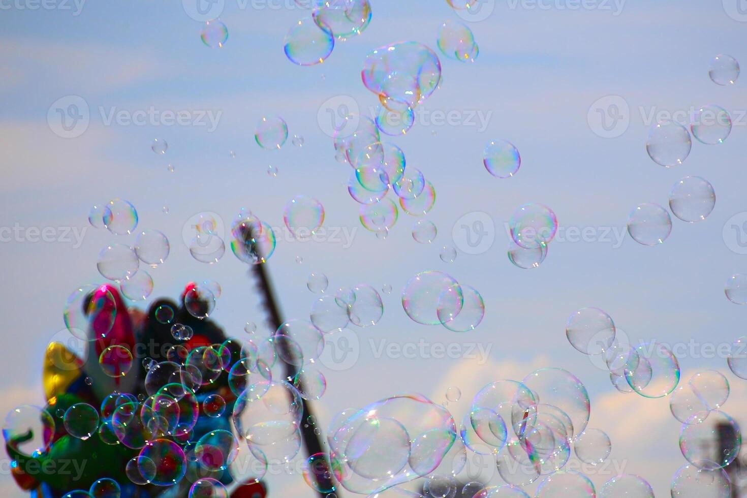 Many colorful bubbles and balloons on a fair photo