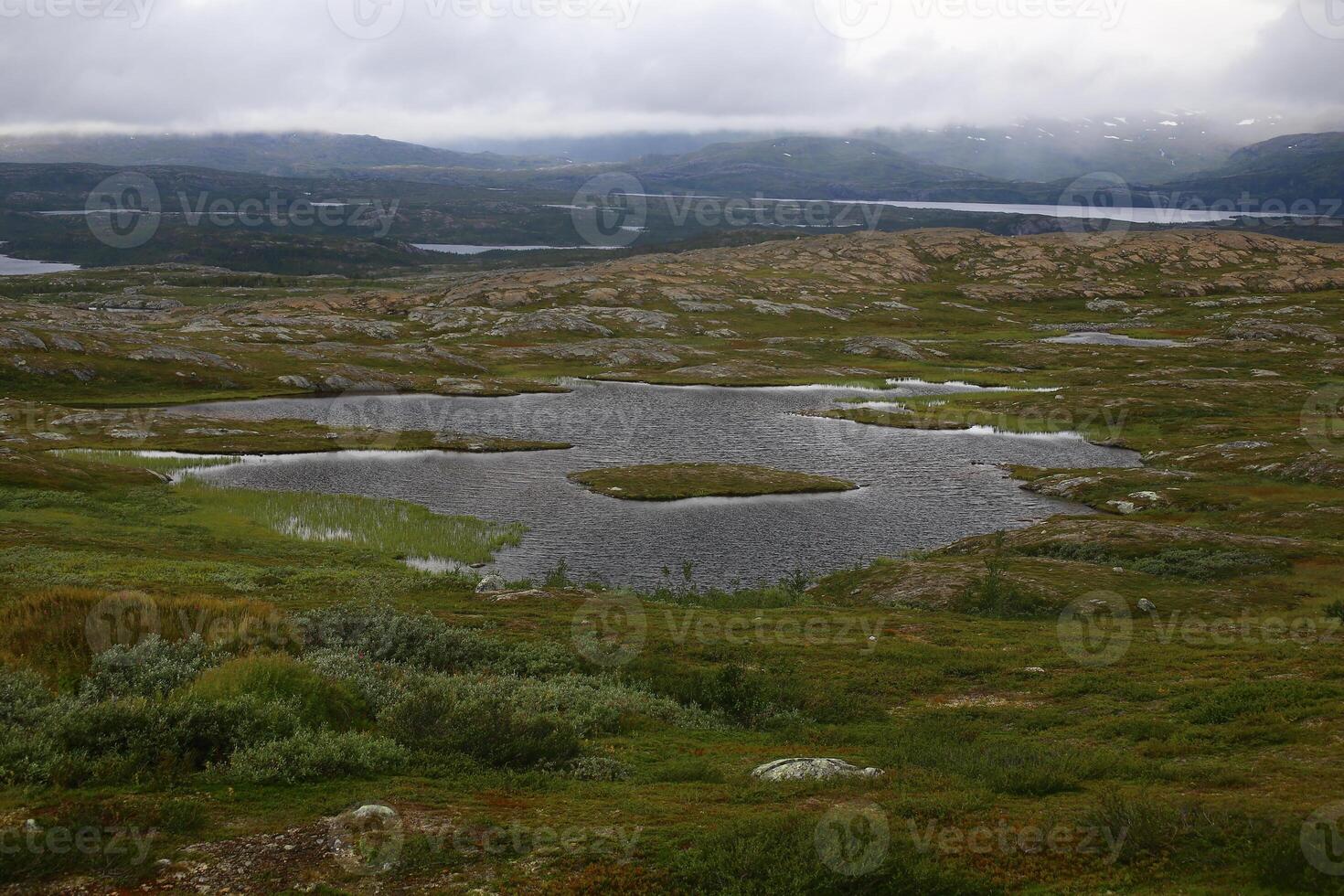 Barren landscape on the abandoned Kuokkel mining field in Swedish Lapland photo