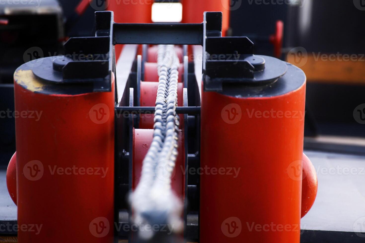Macro of chain in a roller duct photo
