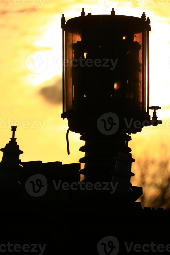 Abstract shot of vintage industrial device with valves and electrical components photo