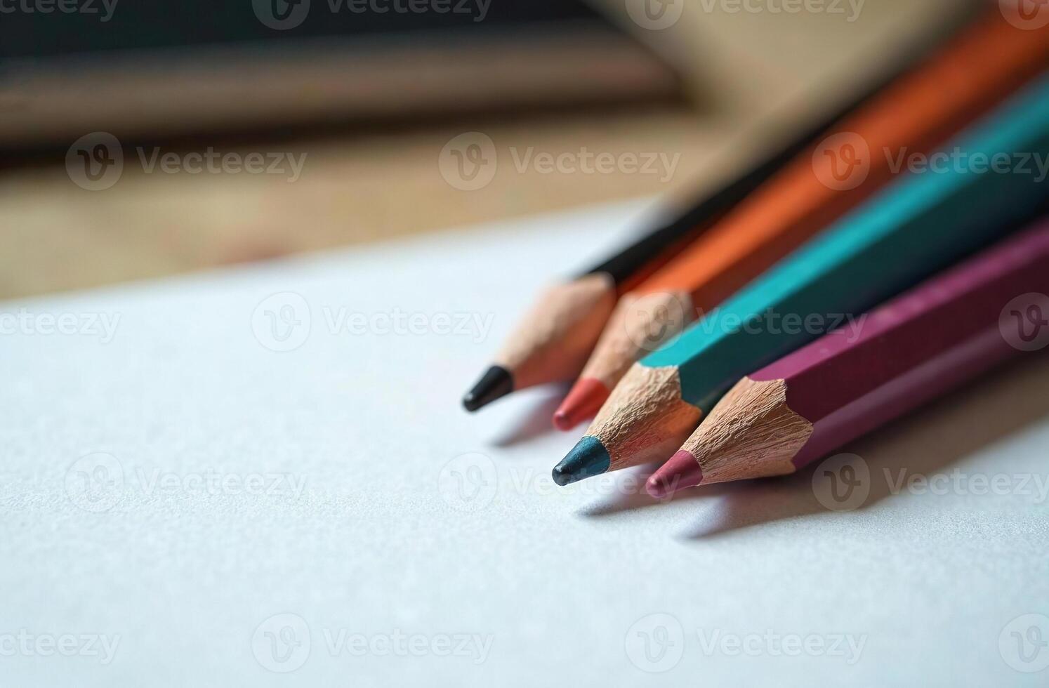 Pencils lie on white paper, art tool for cabinet hobby of drawing photo