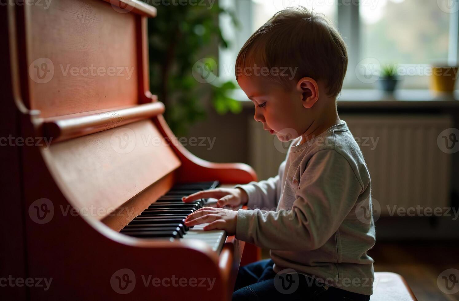 Child playing cool toy piano, young musician play music in playroom photo