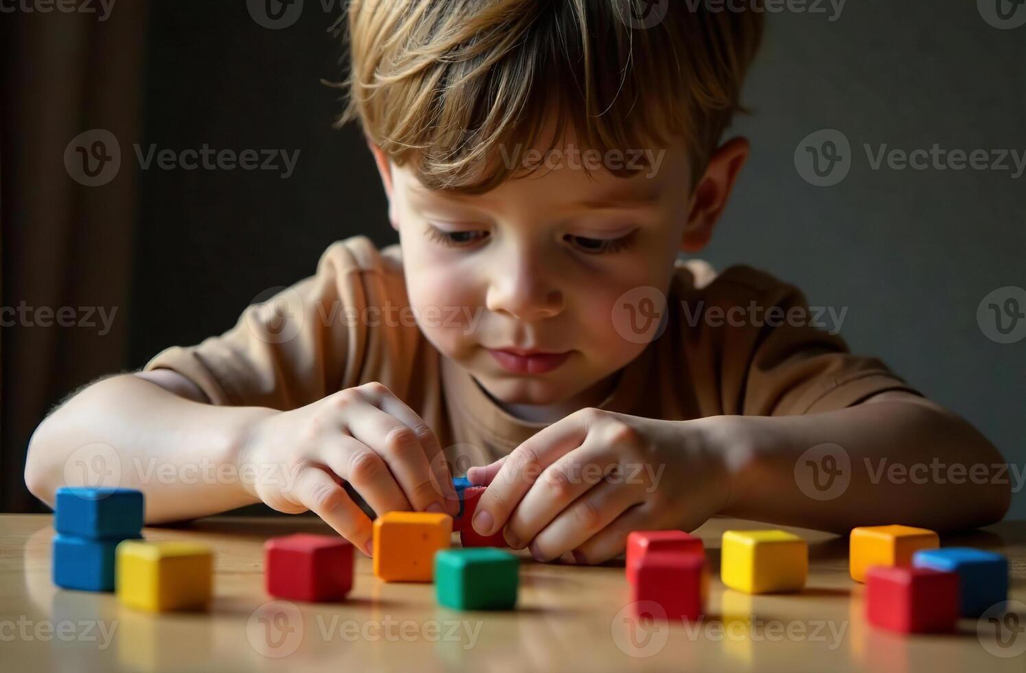 Child cool playing with children toy cubic blocks in the playroom photo