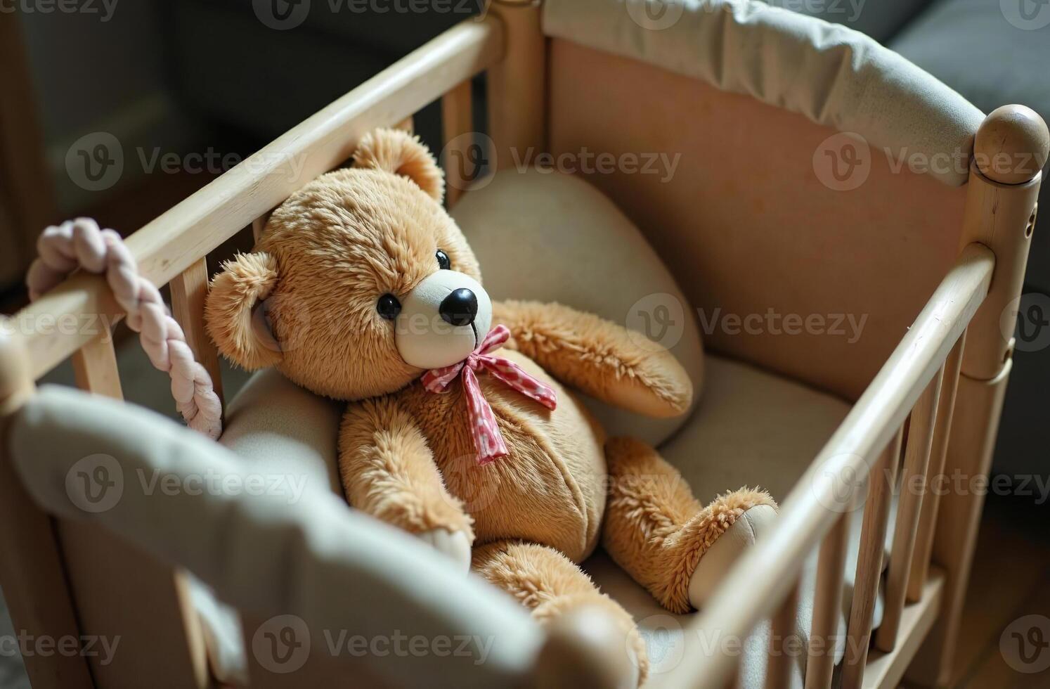 Teddy bear lying in crib, interesting stuffed toy in children bedroom photo