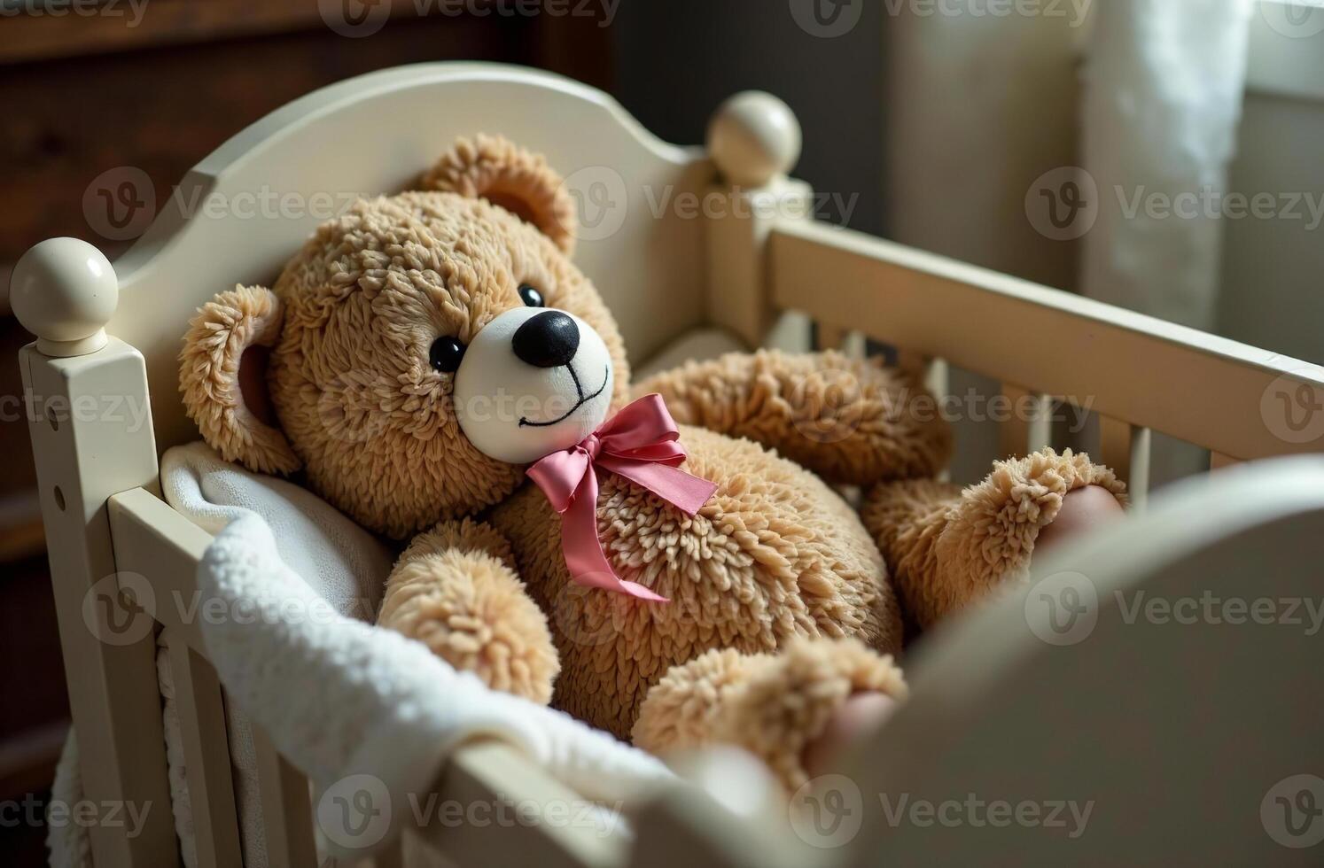 Teddy bear interesting lying in crib, stuffed toy in children bedroom photo
