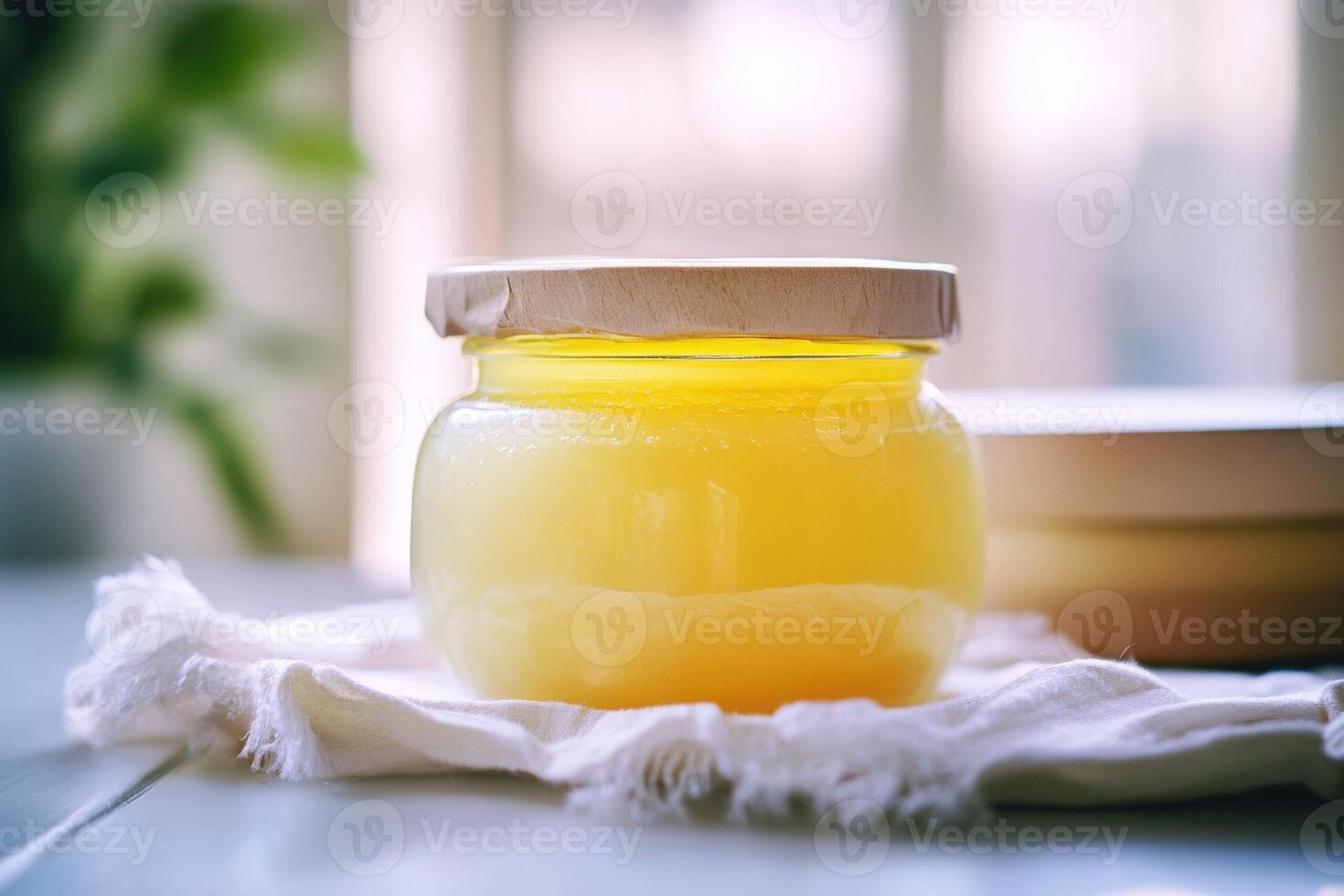 A jar of honey on a table photo