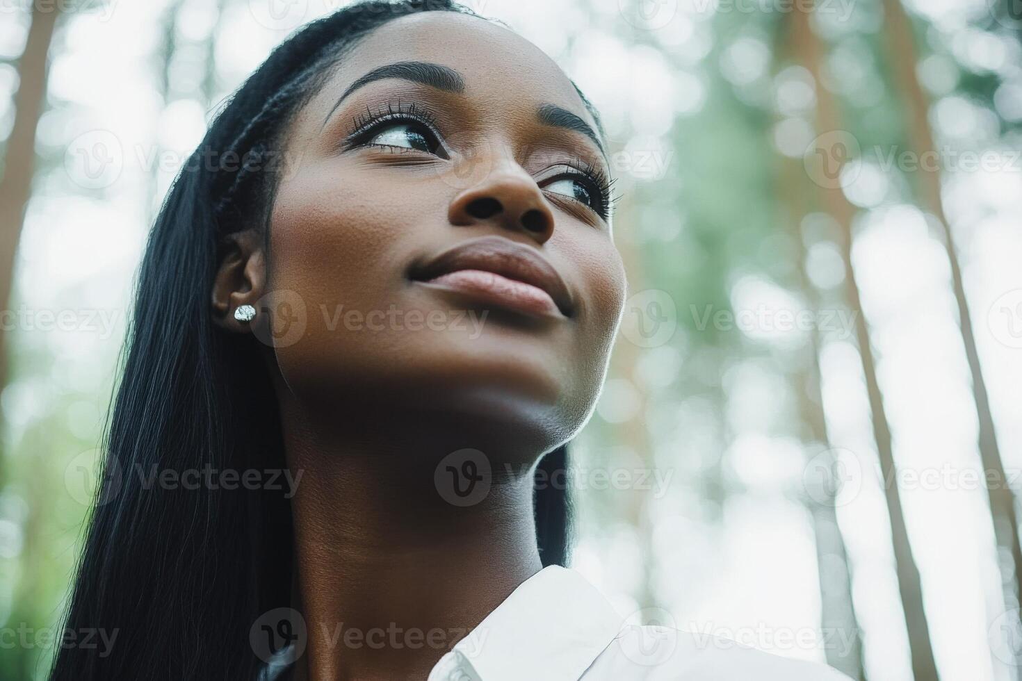 A woman with long hair looking up photo