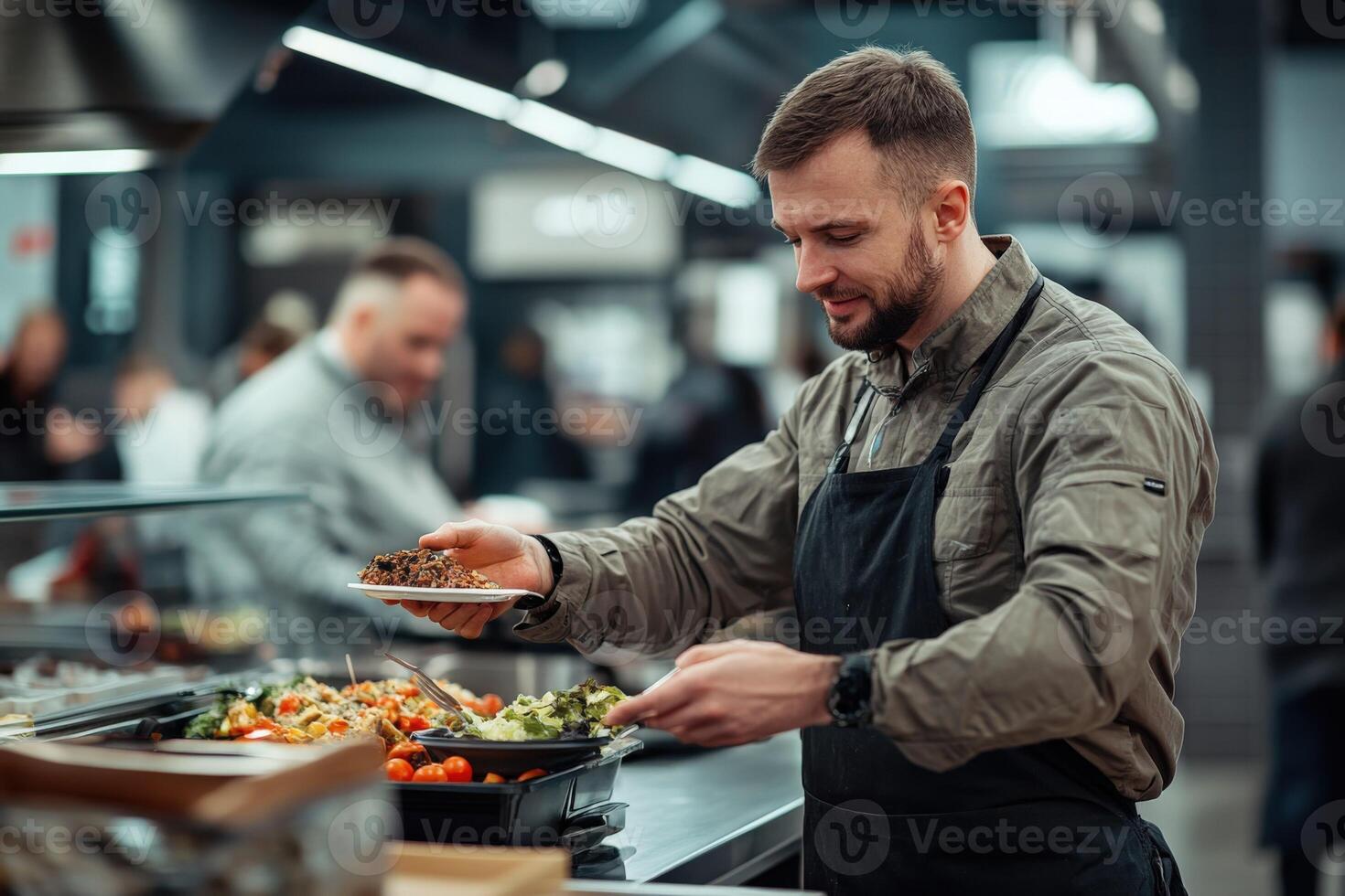A man in an apron is serving food to a customer photo