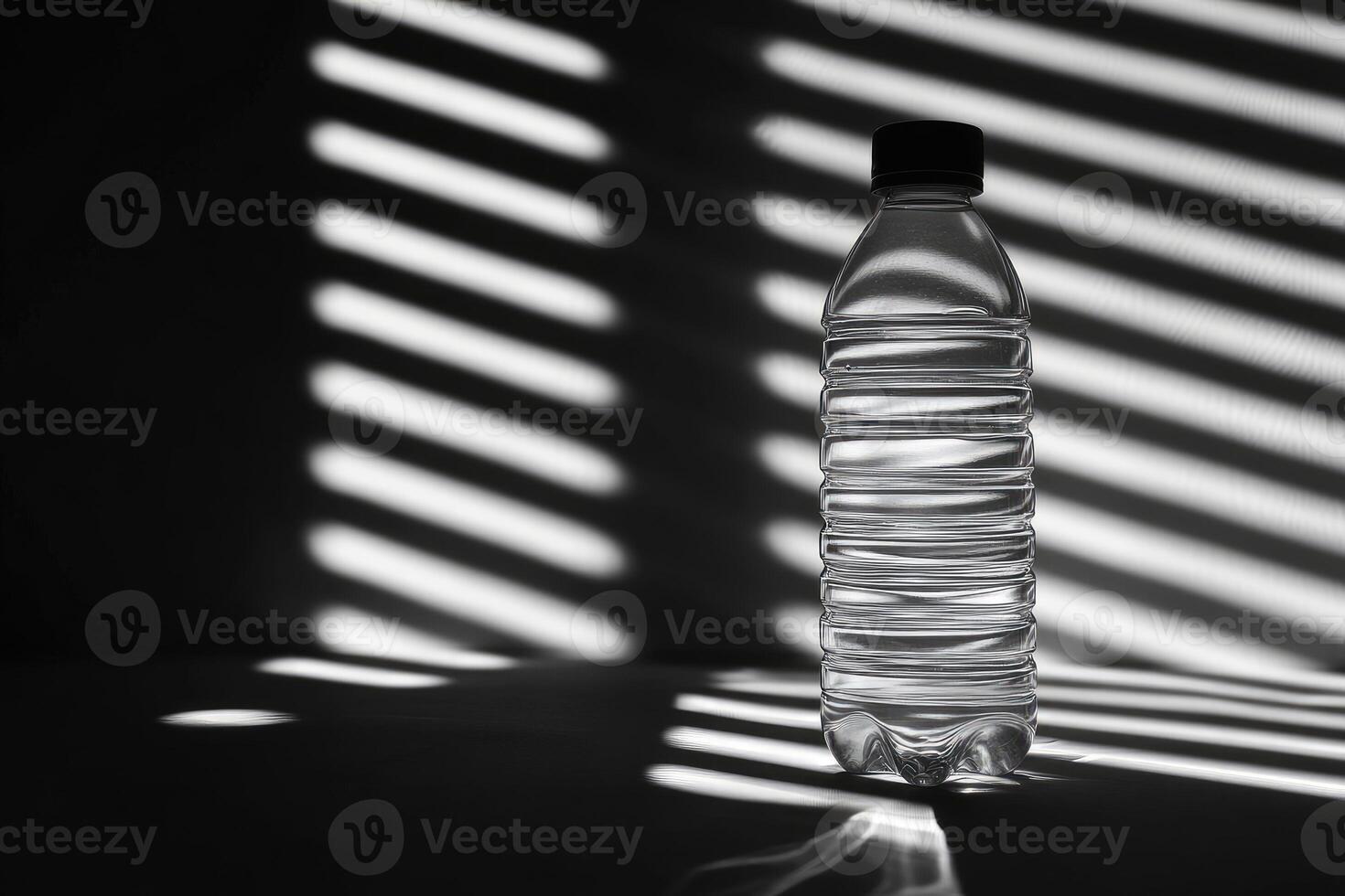 A Single Water Bottle Standing Against a Window with Striped Light Casting Shadows photo