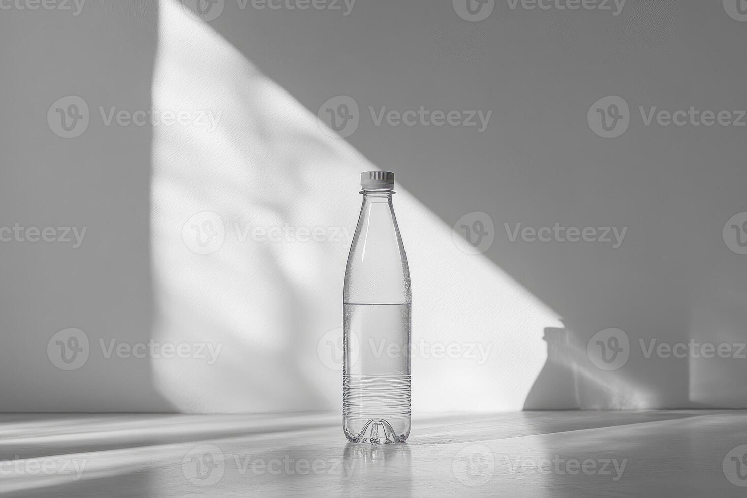 A Clear Plastic Water Bottle with a White Cap on a White Surface photo
