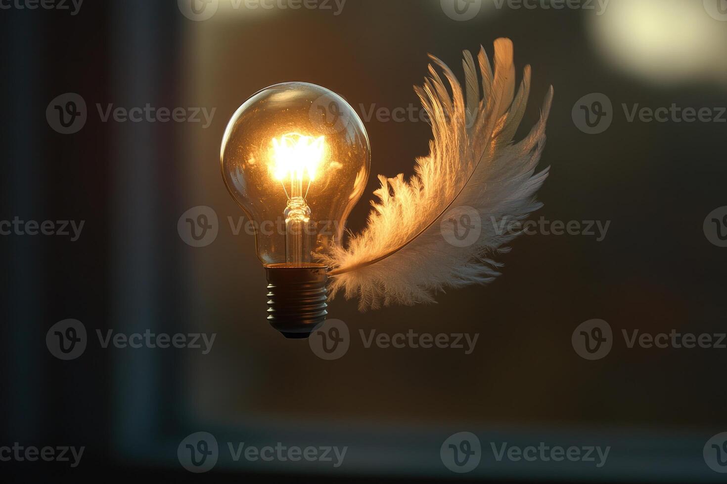 Illuminated Lightbulb with a Single White Feather photo