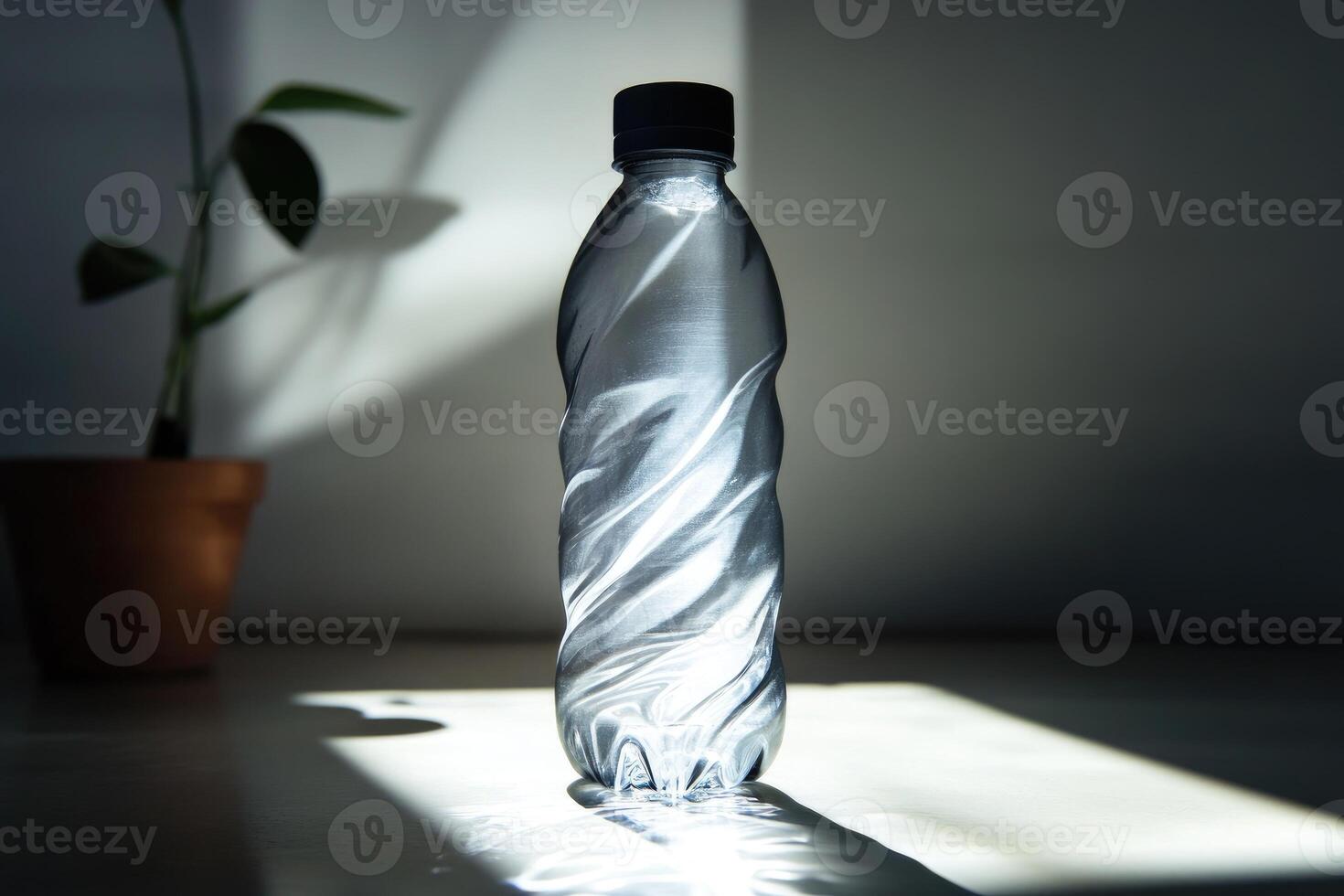 A Plastic Water Bottle with a Black Cap Casts a Shadow on a Tabletop photo
