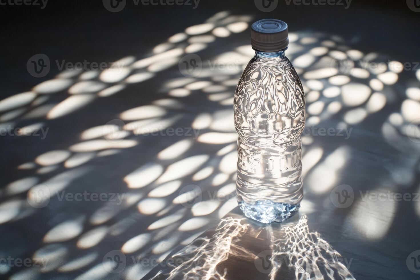 A Plastic Bottle of Water with Sunbeams Creating Light Patterns photo