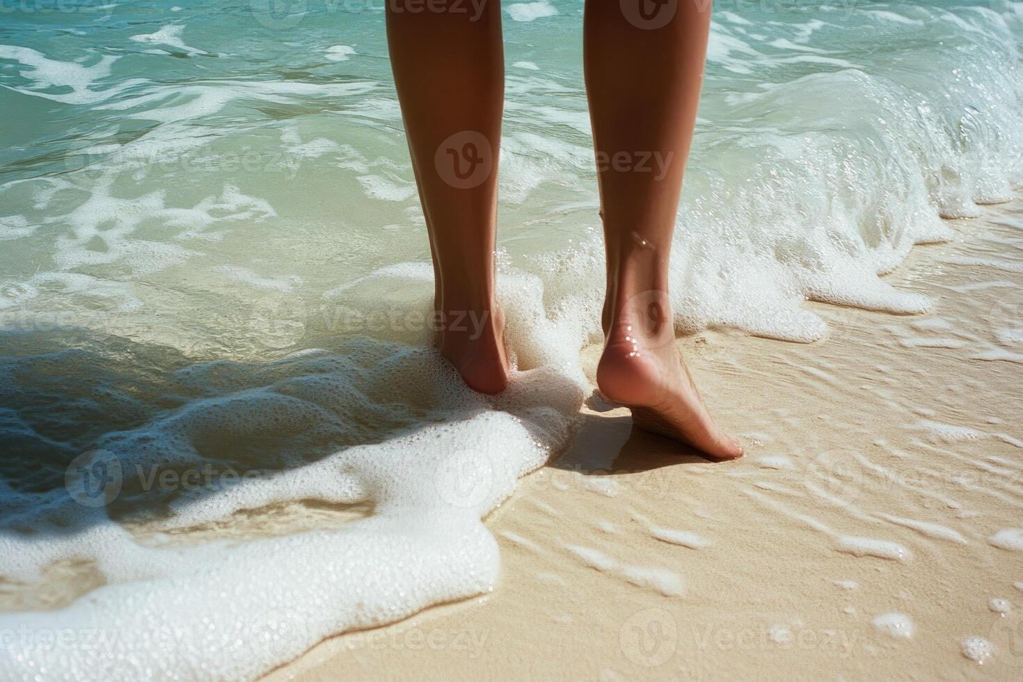 Legs and Foamy Waves on Sandy Beach photo