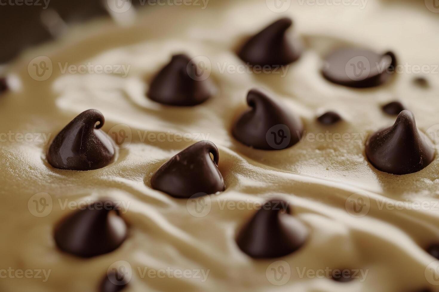 Closeup of chocolate chips in creamy cookie dough photo