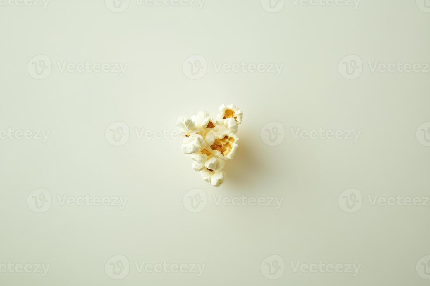 A Small Cluster Of Popcorn On A White Background photo