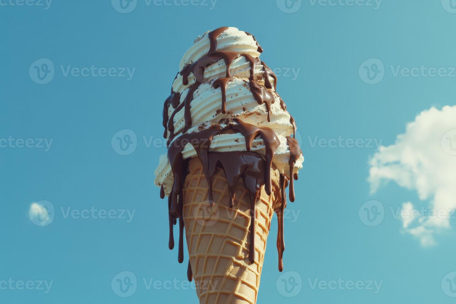 Melted Chocolate Dripping Down Ice Cream Cone photo