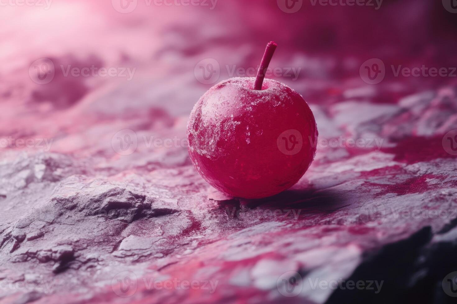 Frozen Red Cherry on a Textured Surface photo