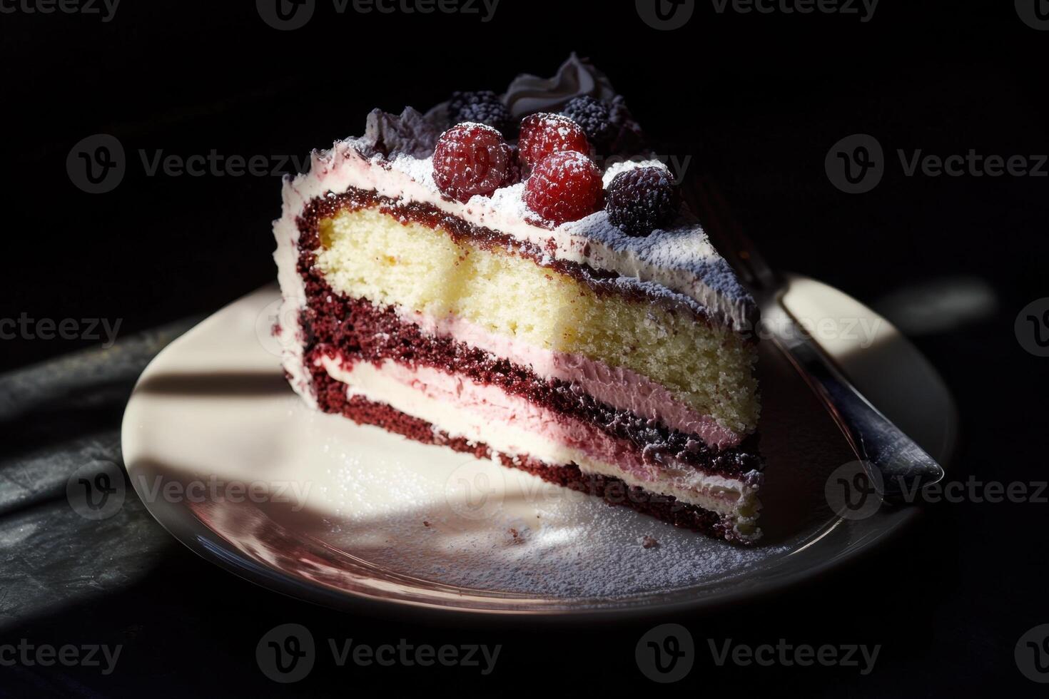 Delicious layered cake with raspberries and frosting photo