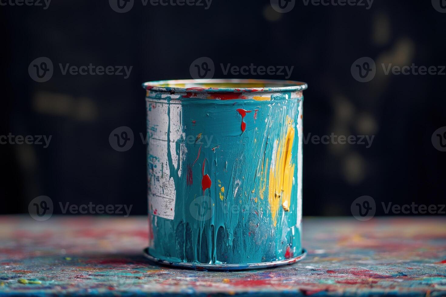 Paint Can Sits On A Colorful Messy Surface photo