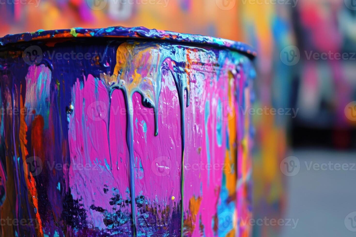 Vibrant Paint Dripping Down a Container photo