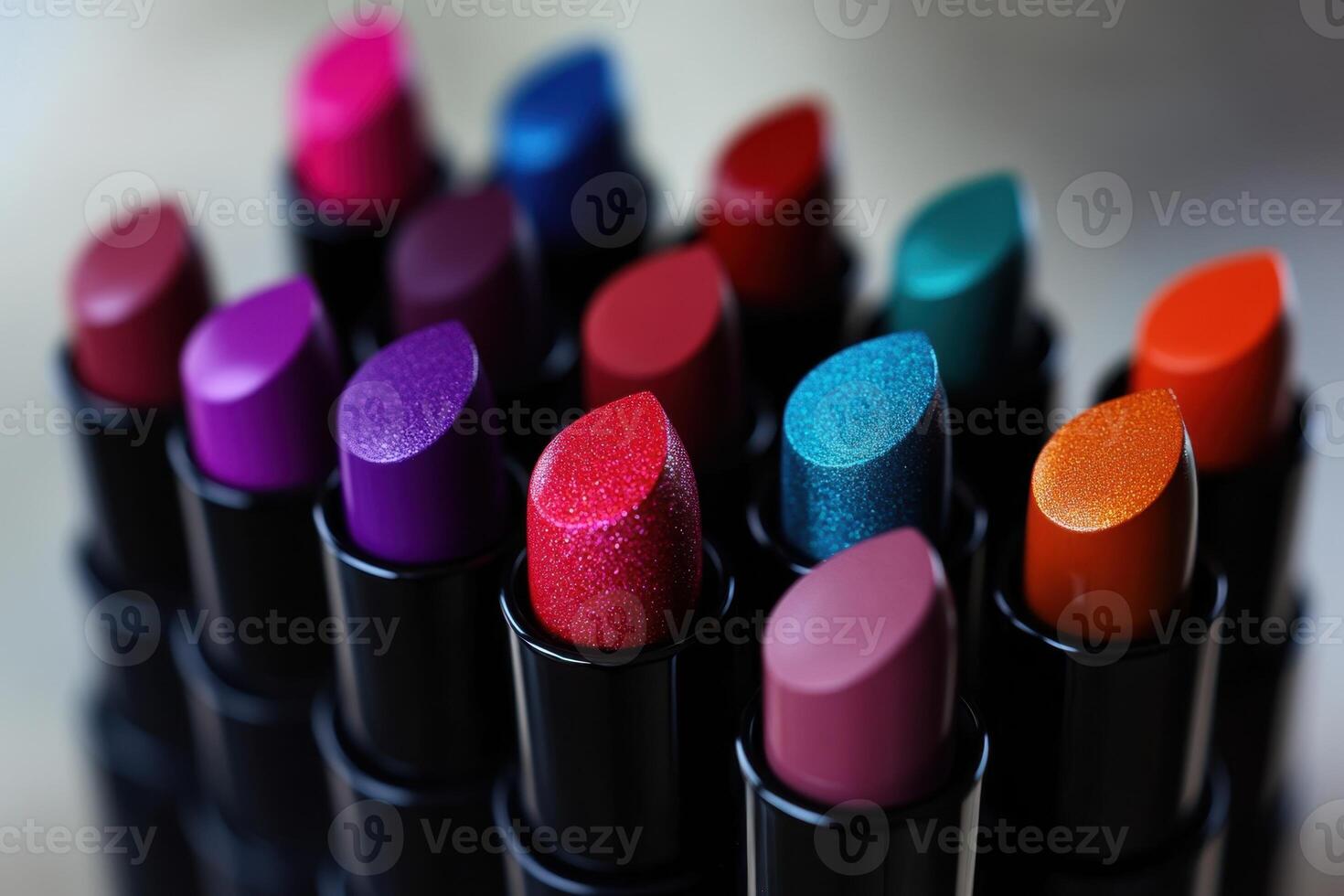 A Collection Of Vibrant Lipstick Shades In Black Cases photo