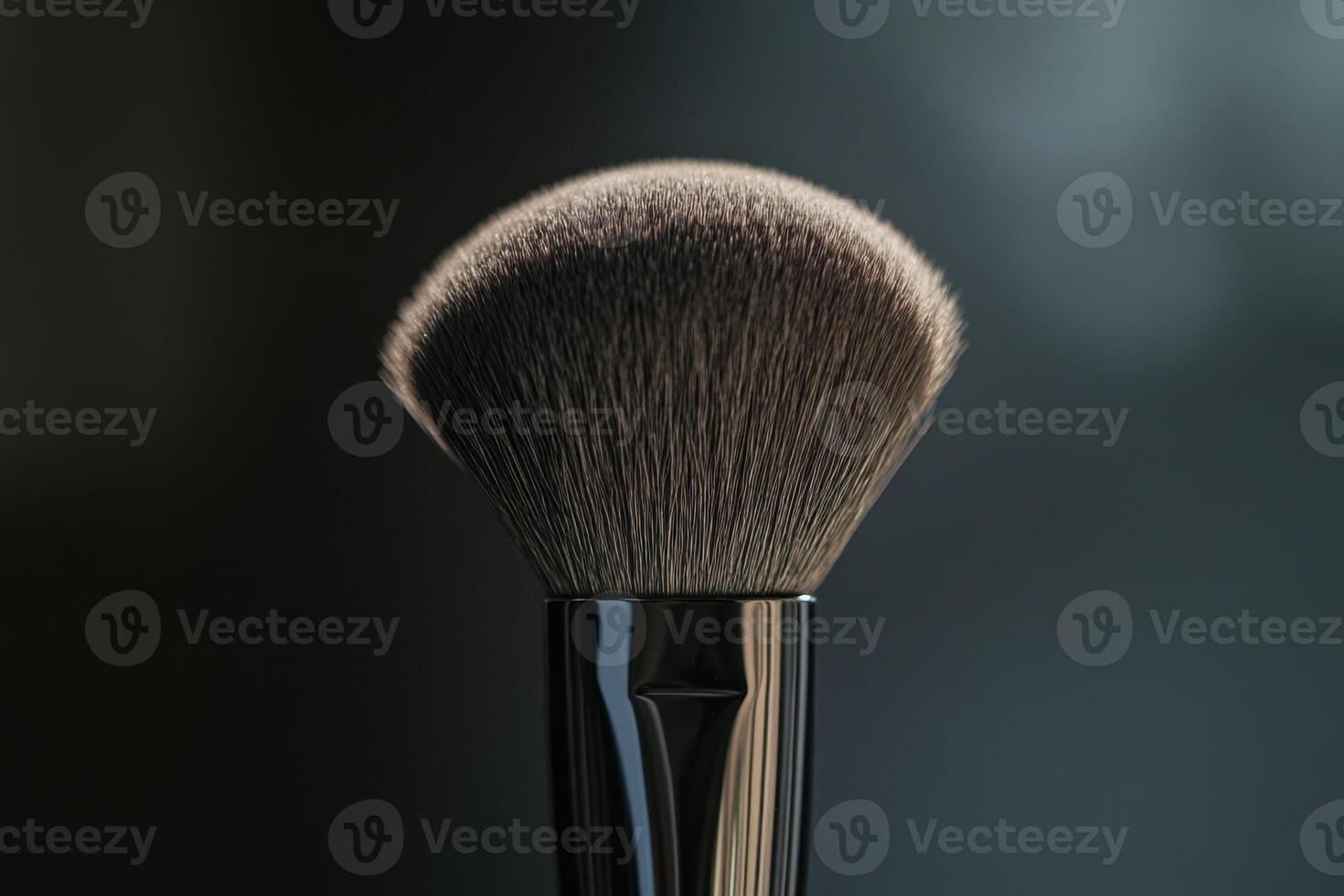 A Close Up View Of A Makeup Powder Brush photo