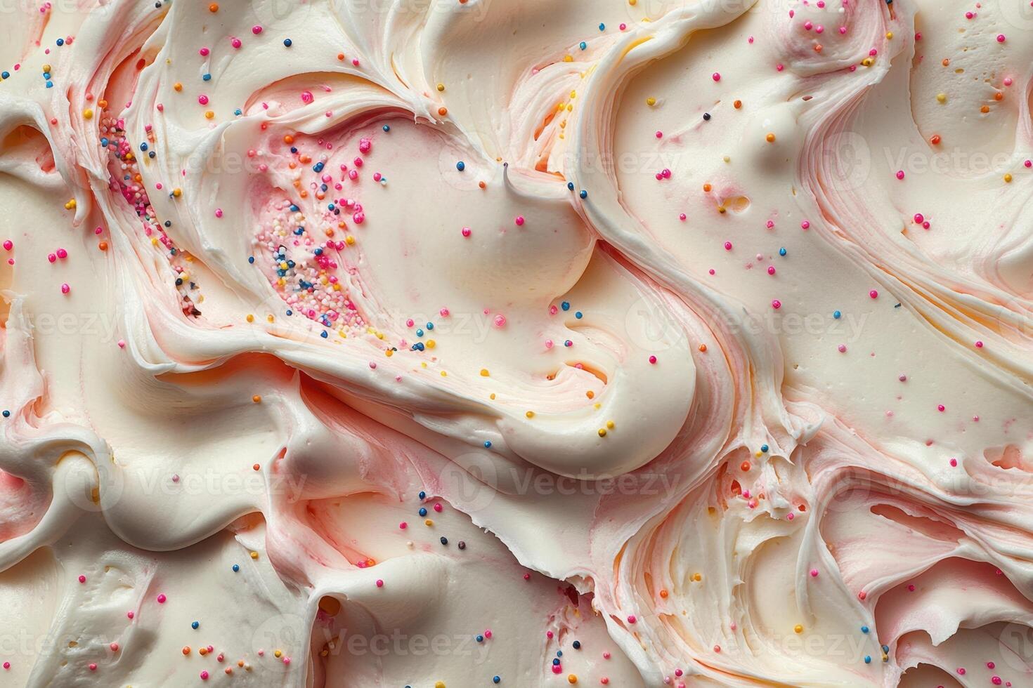 Swirled Cream Frosting With Colorful Sprinkles photo
