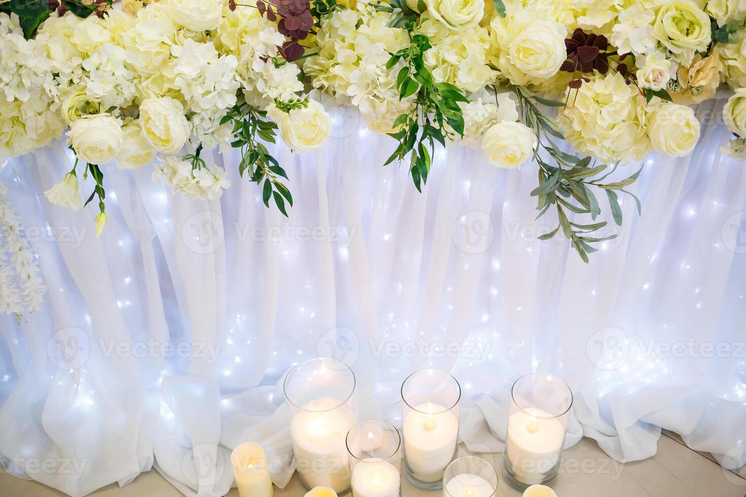 Wedding decor made of flowers and fabric. Beautiful decorations for newlyweds on their wedding day photo