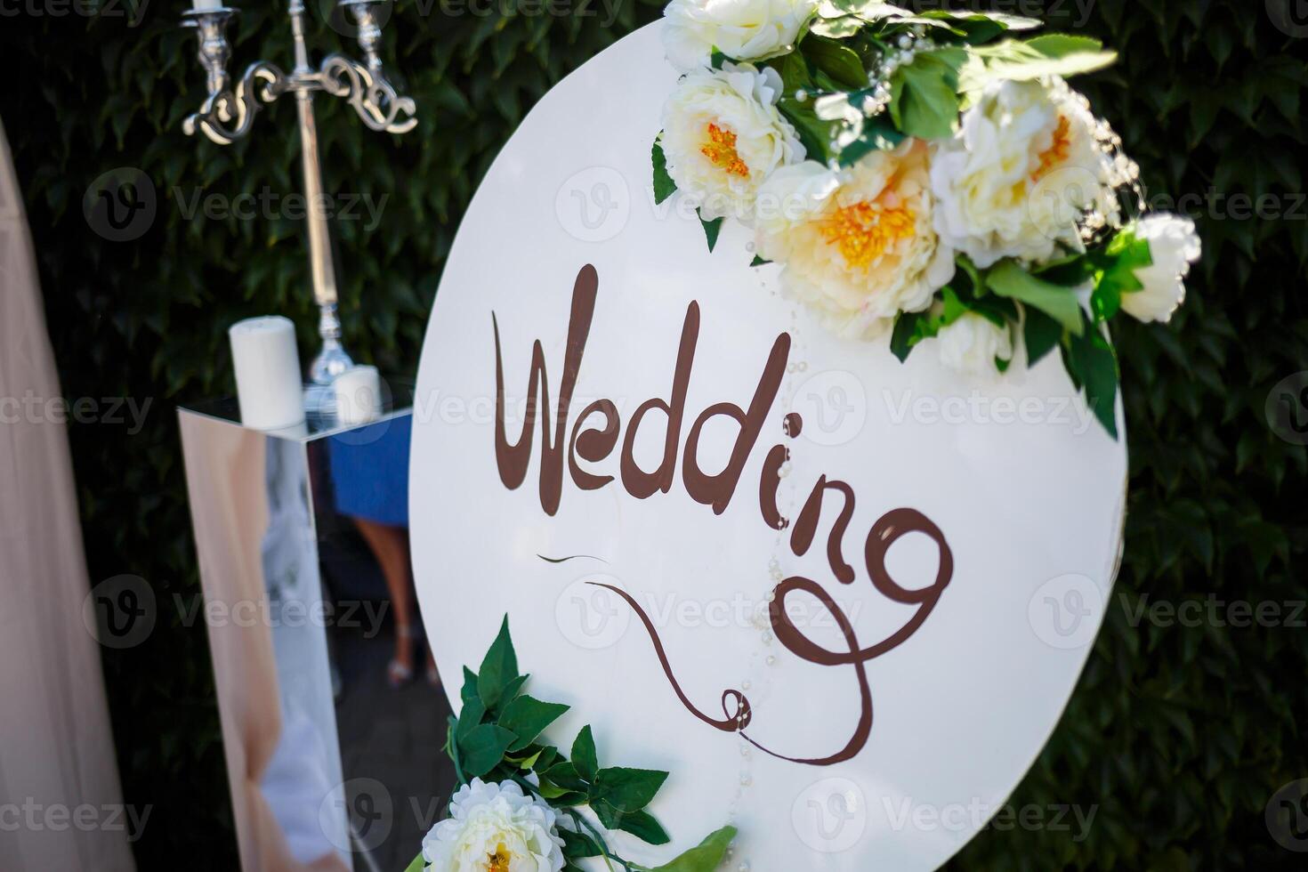Beautiful wedding arch of flowers for the newlyweds. Decoration on a holiday photo