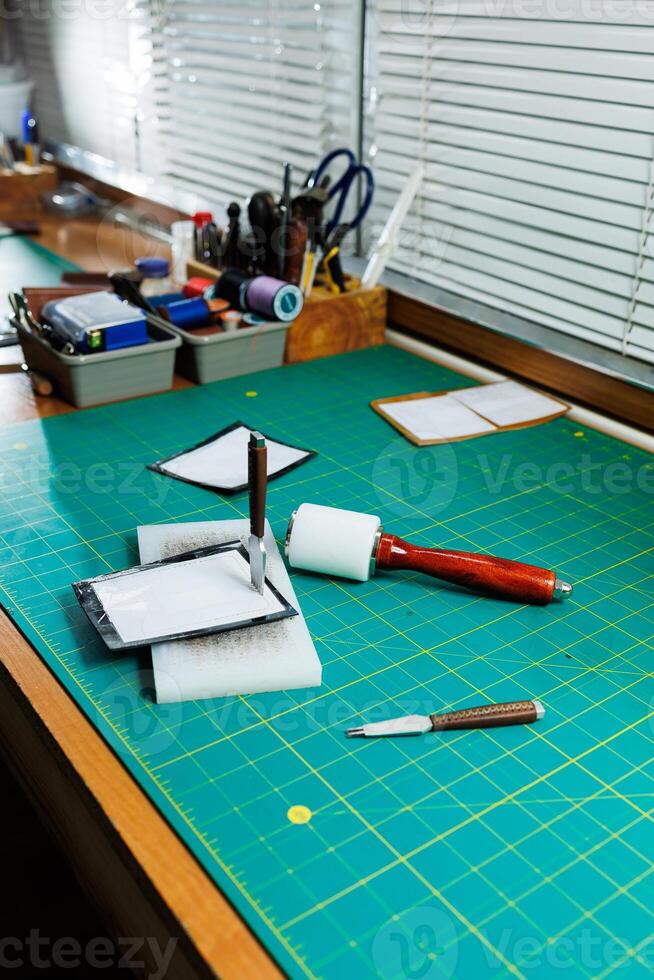 A work table for the manufacture of products from genuine leather. Tools for manual leather work photo