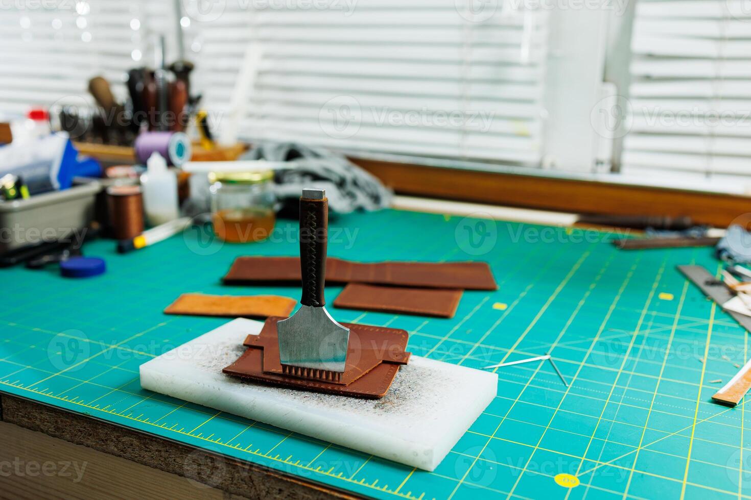 A work table for the manufacture of products from genuine leather. Tools for manual leather work photo