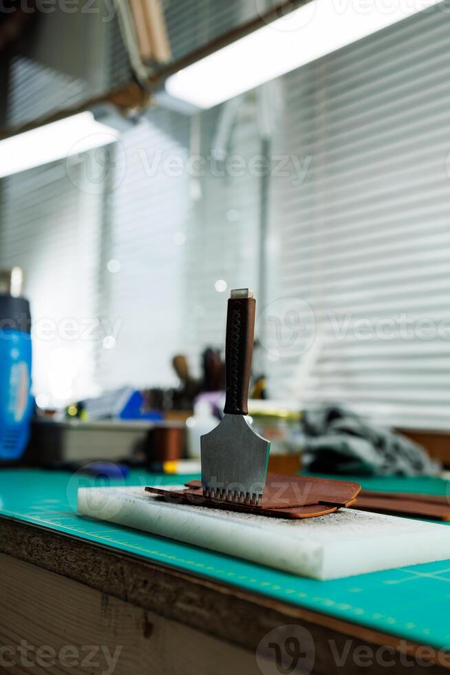 A work table for the manufacture of products from genuine leather. Tools for manual leather work photo