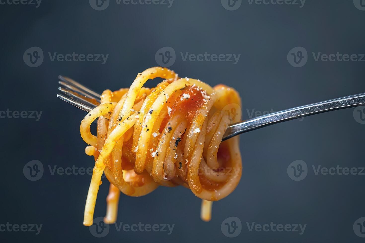 A Delicious Plate of Spaghetti Noodles Twirled with a Fork, Featuring Classic Italian Flavor photo
